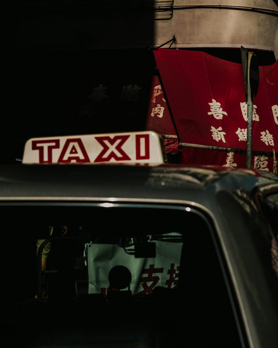 street color photograph of taxi in Hong kong
