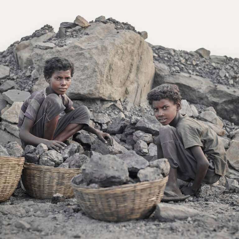 Portrait of two young Indian coal workers by Sebastian Sardi